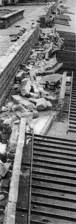 Collapsed wall and railings in Janefield Street